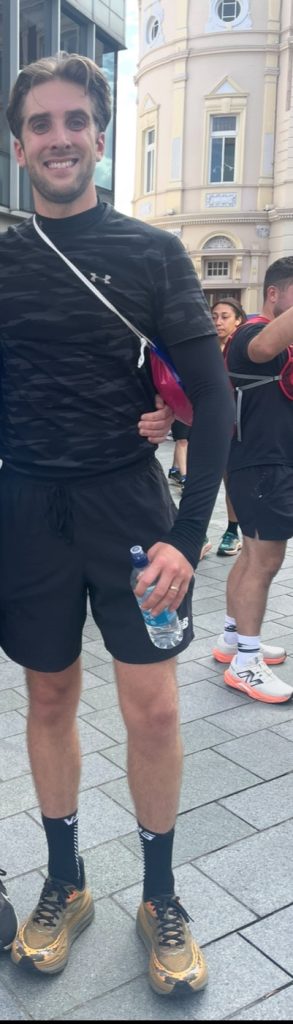 Mike smiles into the camera after running a race.